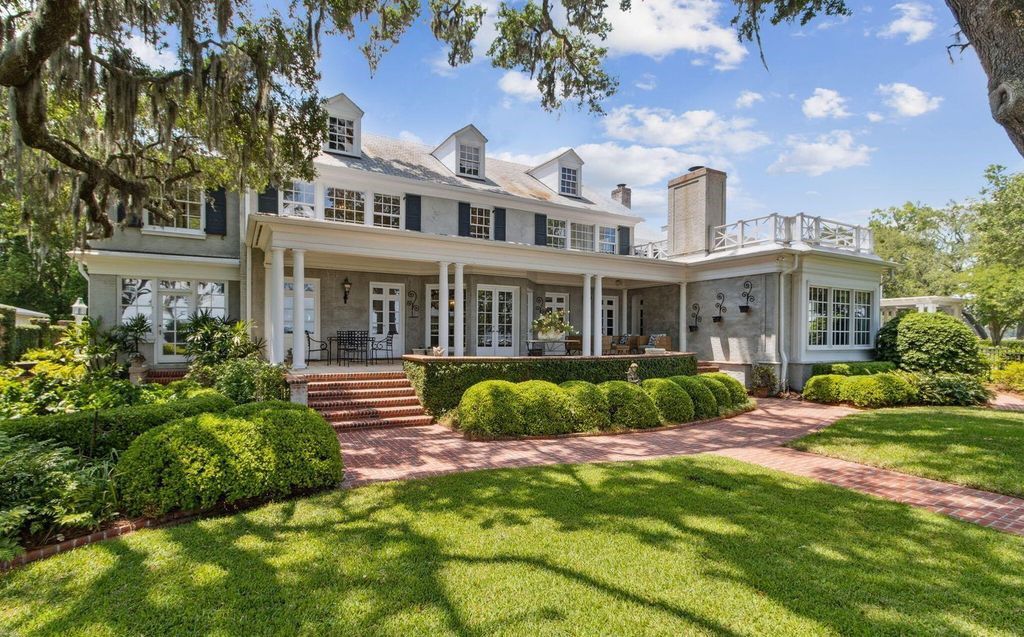 This 5-bedroom estate boasts breathtaking riverfront views, expansive grounds, and a floor plan designed for entertaining. Hardwood floors, fireplaces, and a gourmet kitchen create an unforgettable ambiance.