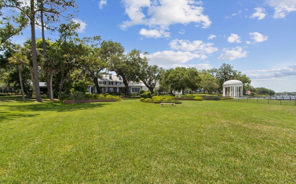 This 5-bedroom estate boasts breathtaking riverfront views, expansive grounds, and a floor plan designed for entertaining. Hardwood floors, fireplaces, and a gourmet kitchen create an unforgettable ambiance.