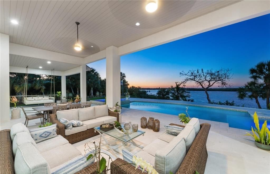 Unwind in paradise at this exquisite 12,000+ square feet estate on a private island in Marco Island. This boater's dream home boasts breathtaking water views, a gourmet kitchen, a wine cellar, a pool, and access to exclusive community amenities. Don't miss this rare opportunity!