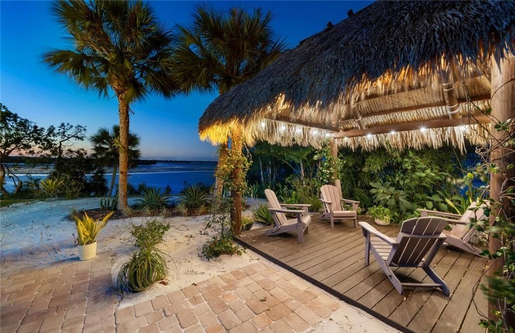 Unwind in paradise at this exquisite 12,000+ square feet estate on a private island in Marco Island. This boater's dream home boasts breathtaking water views, a gourmet kitchen, a wine cellar, a pool, and access to exclusive community amenities. Don't miss this rare opportunity!