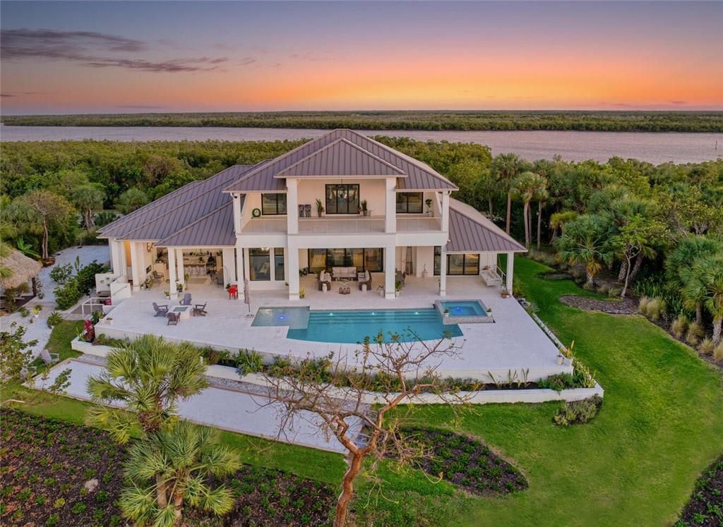 Unwind in paradise at this exquisite 12,000+ square feet estate on a private island in Marco Island. This boater's dream home boasts breathtaking water views, a gourmet kitchen, a wine cellar, a pool, and access to exclusive community amenities. Don't miss this rare opportunity!