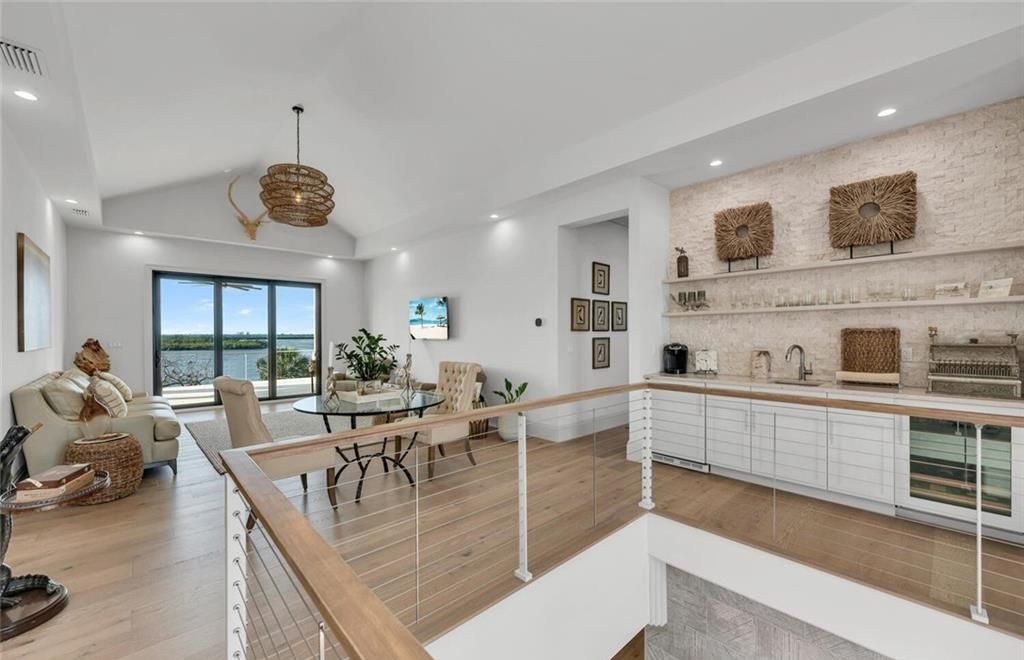 Unwind in paradise at this exquisite 12,000+ square feet estate on a private island in Marco Island. This boater's dream home boasts breathtaking water views, a gourmet kitchen, a wine cellar, a pool, and access to exclusive community amenities. Don't miss this rare opportunity!