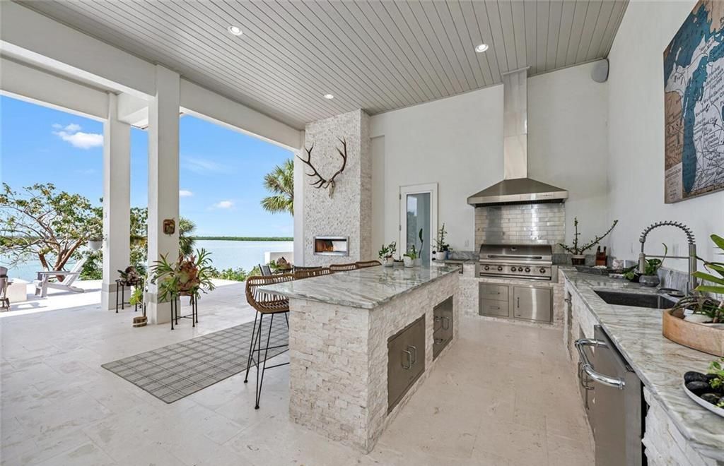 Unwind in paradise at this exquisite 12,000+ square feet estate on a private island in Marco Island. This boater's dream home boasts breathtaking water views, a gourmet kitchen, a wine cellar, a pool, and access to exclusive community amenities. Don't miss this rare opportunity!