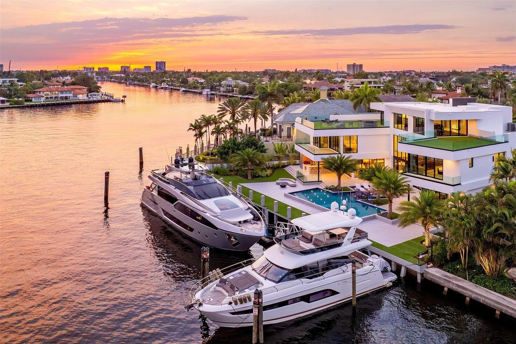 Unmatched Intracoastal views meet unparalleled luxury in this waterfront estate by the esteemed Crest Group and Bruce Celenski. Boasting a spa, media room, gourmet kitchens, smart home features, private dock, pool and rooftop deck, this residence redefines beachfront living.