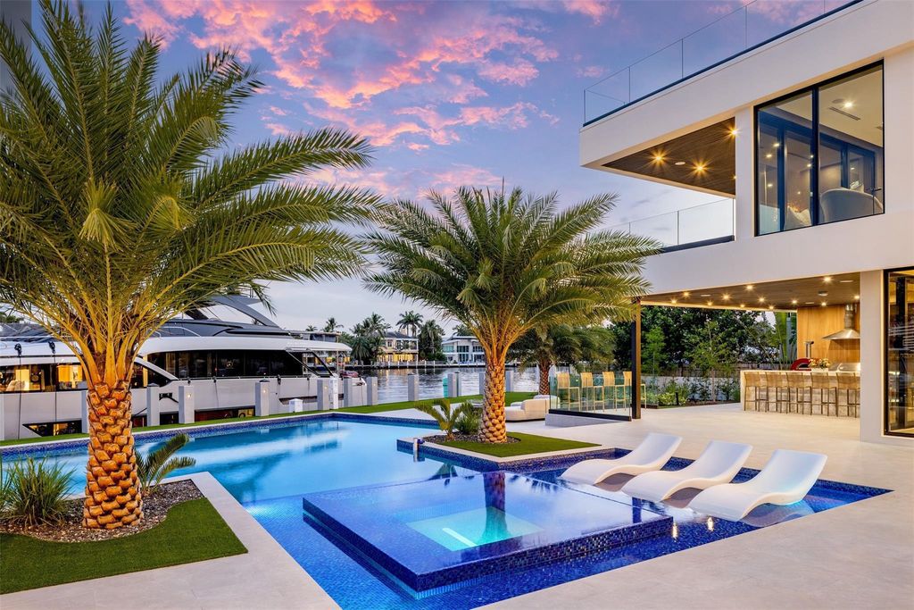 Unmatched Intracoastal views meet unparalleled luxury in this waterfront estate by the esteemed Crest Group and Bruce Celenski. Boasting a spa, media room, gourmet kitchens, smart home features, private dock, pool and rooftop deck, this residence redefines beachfront living.