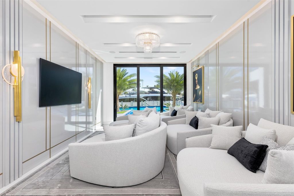 Unmatched Intracoastal views meet unparalleled luxury in this waterfront estate by the esteemed Crest Group and Bruce Celenski. Boasting a spa, media room, gourmet kitchens, smart home features, private dock, pool and rooftop deck, this residence redefines beachfront living.