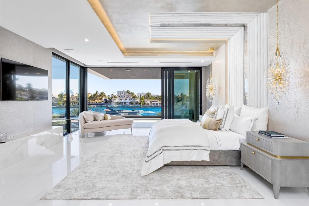 Unmatched Intracoastal views meet unparalleled luxury in this waterfront estate by the esteemed Crest Group and Bruce Celenski. Boasting a spa, media room, gourmet kitchens, smart home features, private dock, pool and rooftop deck, this residence redefines beachfront living.