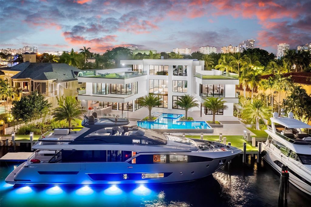 Unmatched Intracoastal views meet unparalleled luxury in this waterfront estate by the esteemed Crest Group and Bruce Celenski. Boasting a spa, media room, gourmet kitchens, smart home features, private dock, pool and rooftop deck, this residence redefines beachfront living.