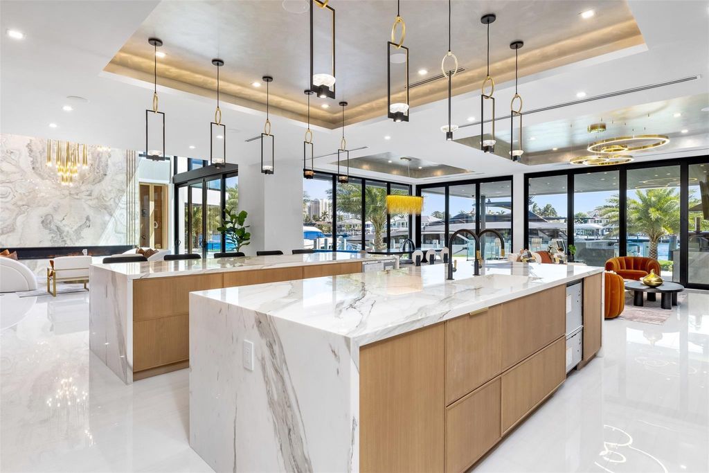 Unmatched Intracoastal views meet unparalleled luxury in this waterfront estate by the esteemed Crest Group and Bruce Celenski. Boasting a spa, media room, gourmet kitchens, smart home features, private dock, pool and rooftop deck, this residence redefines beachfront living.