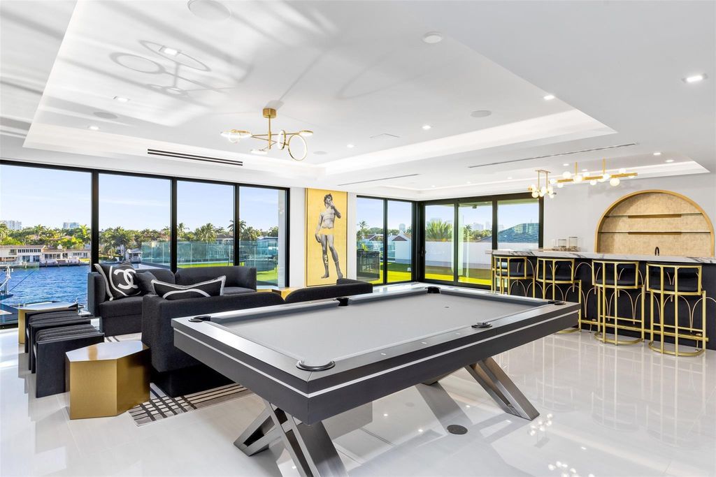 Unmatched Intracoastal views meet unparalleled luxury in this waterfront estate by the esteemed Crest Group and Bruce Celenski. Boasting a spa, media room, gourmet kitchens, smart home features, private dock, pool and rooftop deck, this residence redefines beachfront living.