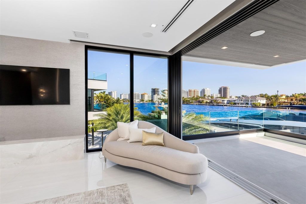 Unmatched Intracoastal views meet unparalleled luxury in this waterfront estate by the esteemed Crest Group and Bruce Celenski. Boasting a spa, media room, gourmet kitchens, smart home features, private dock, pool and rooftop deck, this residence redefines beachfront living.