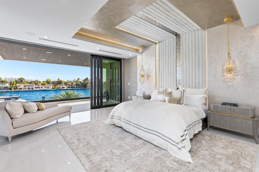 Unmatched Intracoastal views meet unparalleled luxury in this waterfront estate by the esteemed Crest Group and Bruce Celenski. Boasting a spa, media room, gourmet kitchens, smart home features, private dock, pool and rooftop deck, this residence redefines beachfront living.