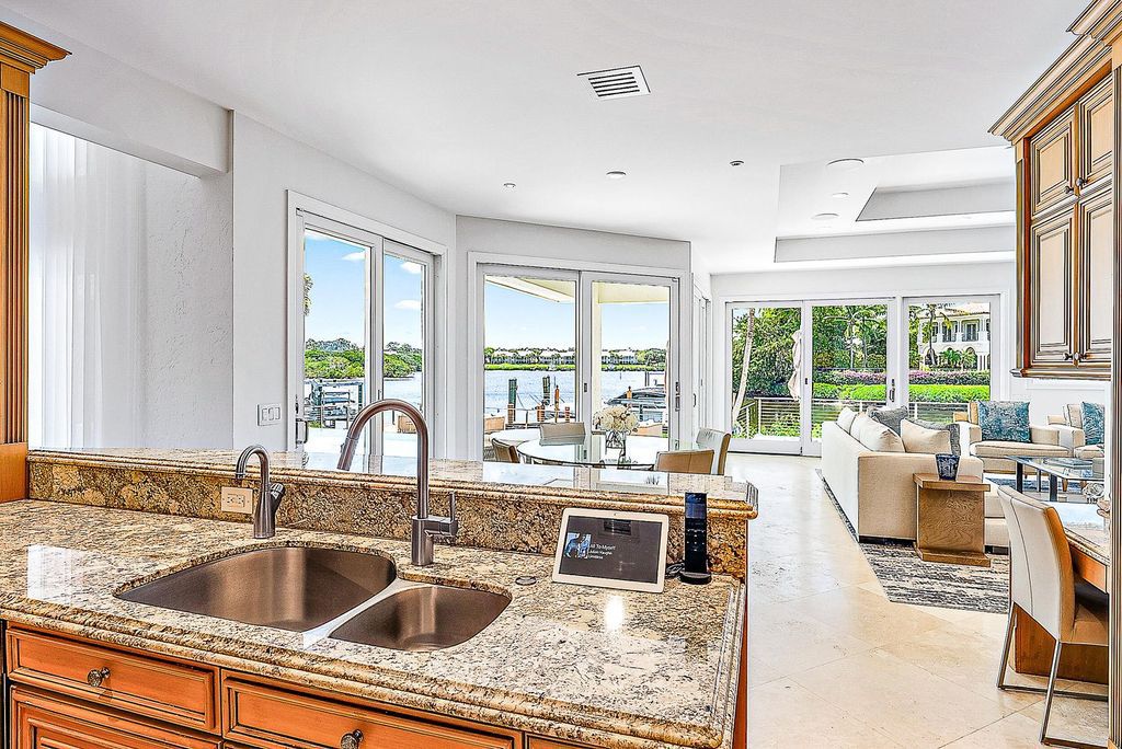 Immerse yourself in luxury living at this custom waterfront estate. Breathtaking water views, sunsets, and a private dock make this your dream home. Updated kitchen, spacious suites, and prime location near the Club. Schedule a showing today!