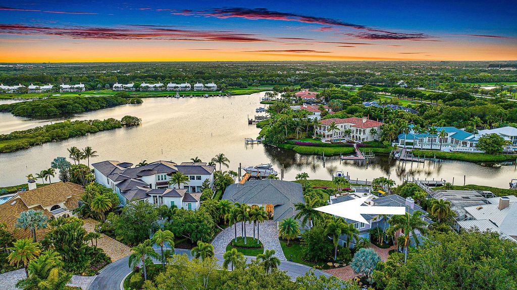 Immerse yourself in luxury living at this custom waterfront estate. Breathtaking water views, sunsets, and a private dock make this your dream home. Updated kitchen, spacious suites, and prime location near the Club. Schedule a showing today!