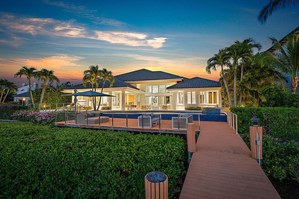 Immerse yourself in luxury living at this custom waterfront estate. Breathtaking water views, sunsets, and a private dock make this your dream home. Updated kitchen, spacious suites, and prime location near the Club. Schedule a showing today!