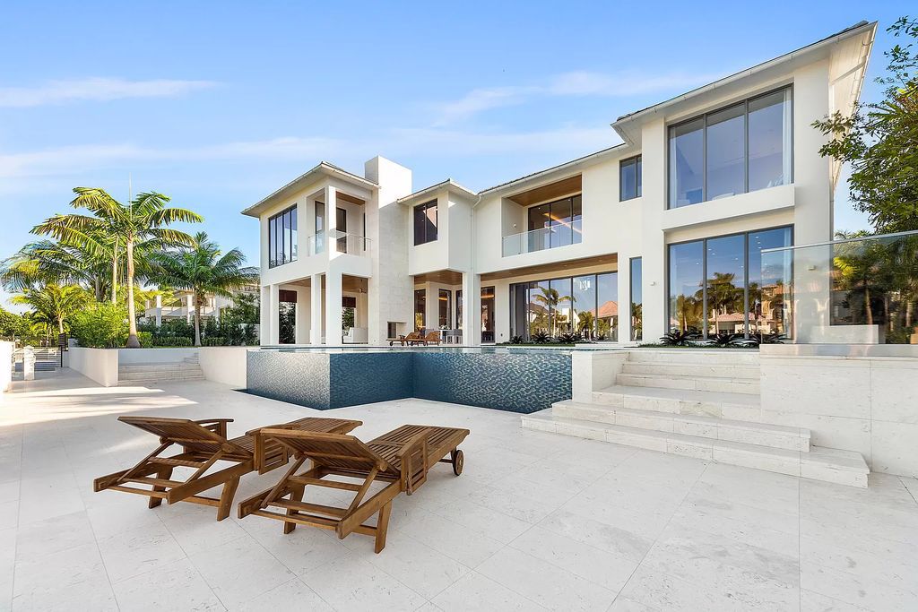 Experience unparalleled luxury at Villa Bianca, a contemporary jewel in Boca Raton's Royal Palm Yacht and Country Club. This 8,862 square feet waterfront estate boasts 6 bedrooms, 8 bathrooms, and an infinity-edge pool, offering the epitome of Italian design and craftsmanship.