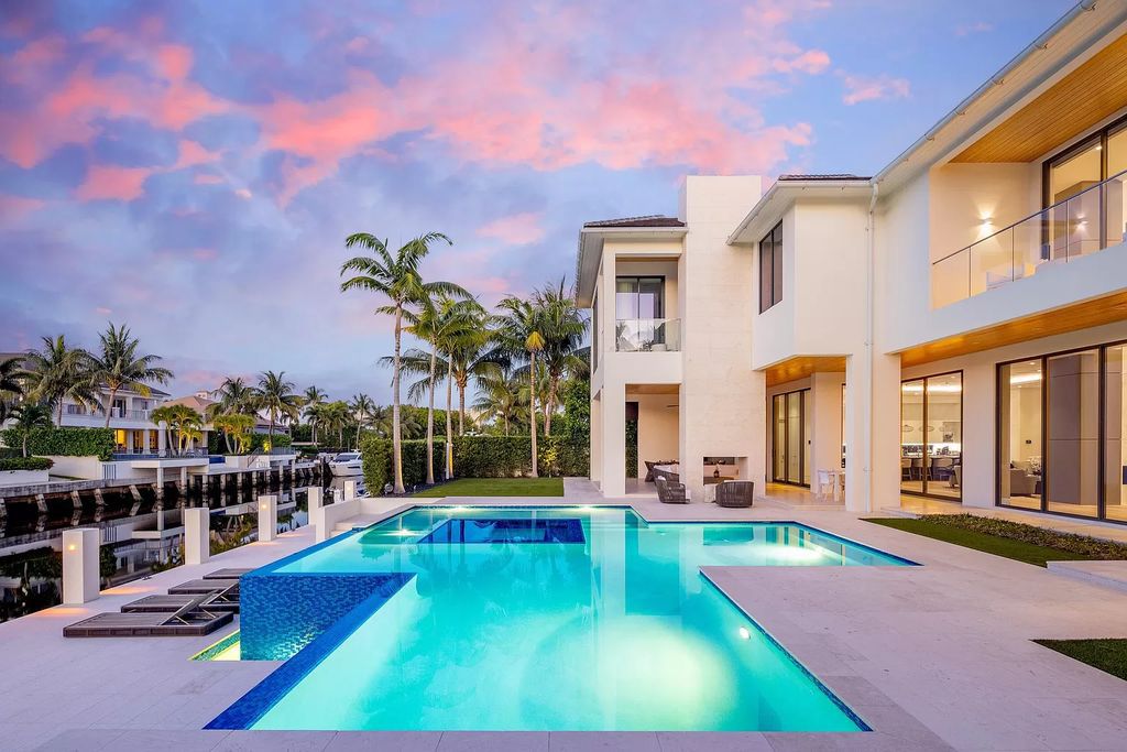 Experience unparalleled luxury at Villa Bianca, a contemporary jewel in Boca Raton's Royal Palm Yacht and Country Club. This 8,862 square feet waterfront estate boasts 6 bedrooms, 8 bathrooms, and an infinity-edge pool, offering the epitome of Italian design and craftsmanship.