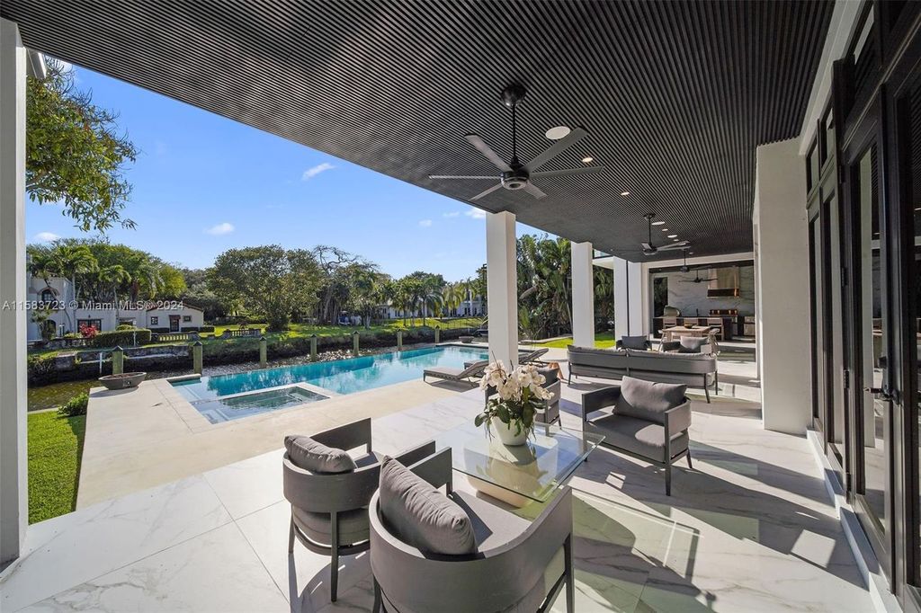 Indulge in unparalleled luxury living on the Coral Gables Waterway. This custom-built estate boasts an infinity pool, boat dock, home theater, opulent master suite, and breathtaking water views. Explore the complete estate and discover your dream home today.