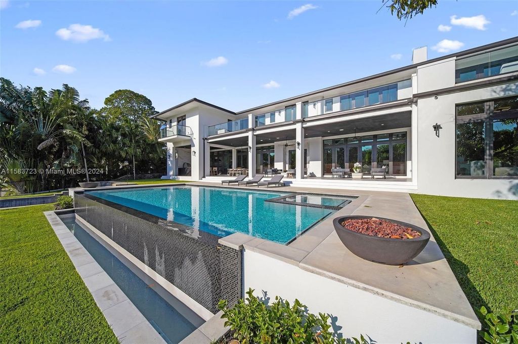 Indulge in unparalleled luxury living on the Coral Gables Waterway. This custom-built estate boasts an infinity pool, boat dock, home theater, opulent master suite, and breathtaking water views. Explore the complete estate and discover your dream home today.