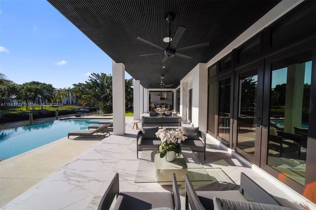 Indulge in unparalleled luxury living on the Coral Gables Waterway. This custom-built estate boasts an infinity pool, boat dock, home theater, opulent master suite, and breathtaking water views. Explore the complete estate and discover your dream home today.