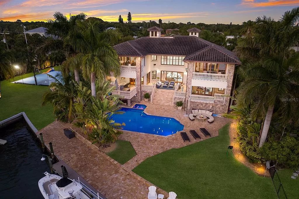 This 7,960 square feet waterfront mansion in San Remo Estates offers unparalleled luxury living. Imagine sprawling bay views, a sparkling pool with swim-up bar, gourmet kitchen, and multiple terraces for entertaining.