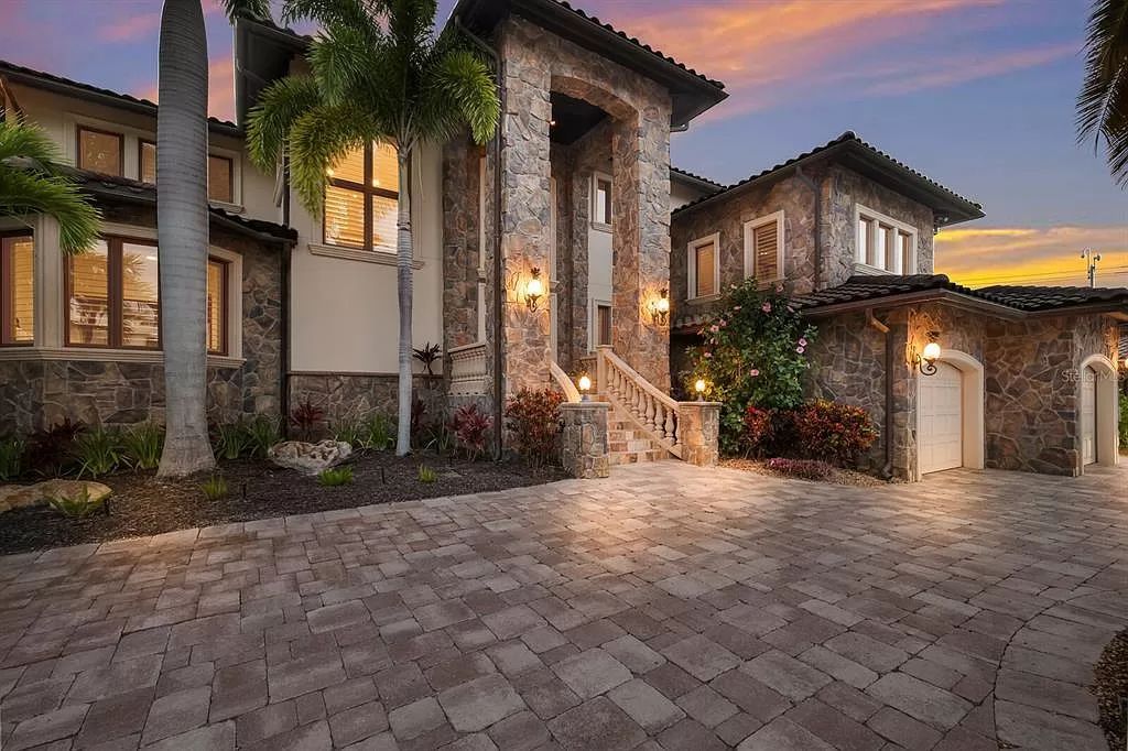 This 7,960 square feet waterfront mansion in San Remo Estates offers unparalleled luxury living. Imagine sprawling bay views, a sparkling pool with swim-up bar, gourmet kitchen, and multiple terraces for entertaining.