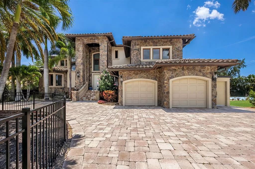 This 7,960 square feet waterfront mansion in San Remo Estates offers unparalleled luxury living. Imagine sprawling bay views, a sparkling pool with swim-up bar, gourmet kitchen, and multiple terraces for entertaining.