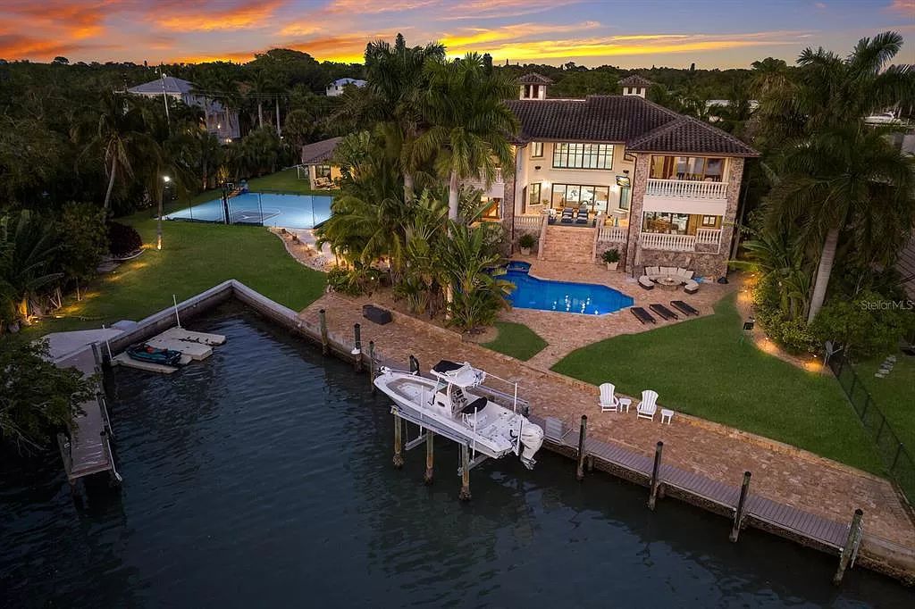 This 7,960 square feet waterfront mansion in San Remo Estates offers unparalleled luxury living. Imagine sprawling bay views, a sparkling pool with swim-up bar, gourmet kitchen, and multiple terraces for entertaining.