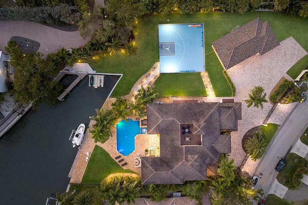 This 7,960 square feet waterfront mansion in San Remo Estates offers unparalleled luxury living. Imagine sprawling bay views, a sparkling pool with swim-up bar, gourmet kitchen, and multiple terraces for entertaining.