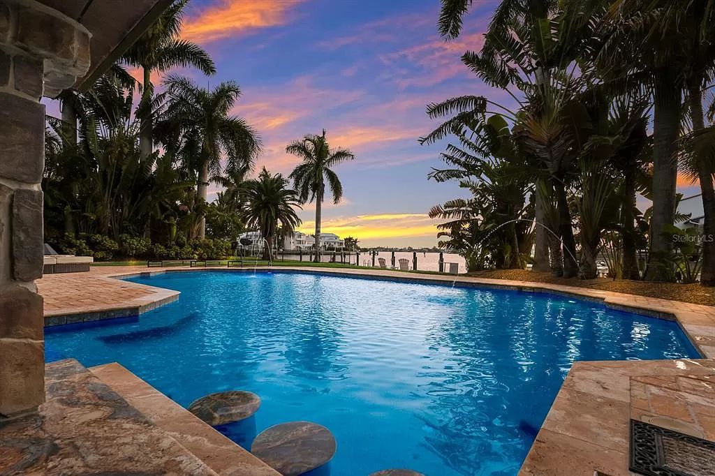 This 7,960 square feet waterfront mansion in San Remo Estates offers unparalleled luxury living. Imagine sprawling bay views, a sparkling pool with swim-up bar, gourmet kitchen, and multiple terraces for entertaining.