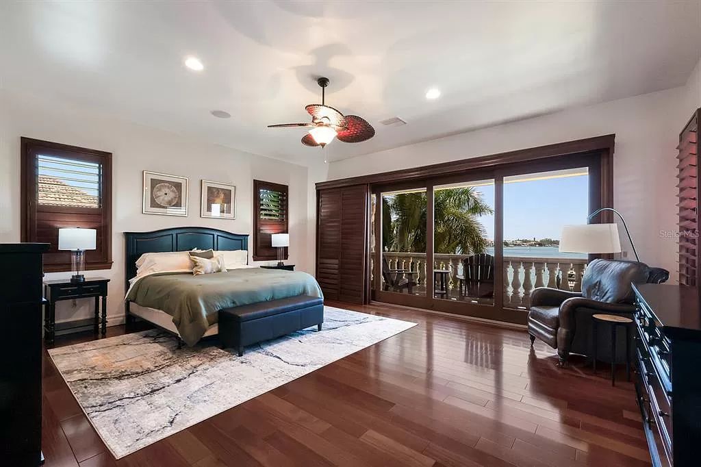 This 7,960 square feet waterfront mansion in San Remo Estates offers unparalleled luxury living. Imagine sprawling bay views, a sparkling pool with swim-up bar, gourmet kitchen, and multiple terraces for entertaining.