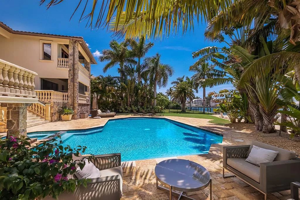 This 7,960 square feet waterfront mansion in San Remo Estates offers unparalleled luxury living. Imagine sprawling bay views, a sparkling pool with swim-up bar, gourmet kitchen, and multiple terraces for entertaining.