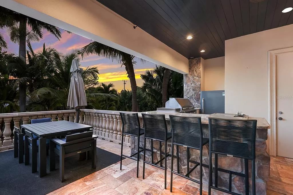 This 7,960 square feet waterfront mansion in San Remo Estates offers unparalleled luxury living. Imagine sprawling bay views, a sparkling pool with swim-up bar, gourmet kitchen, and multiple terraces for entertaining.