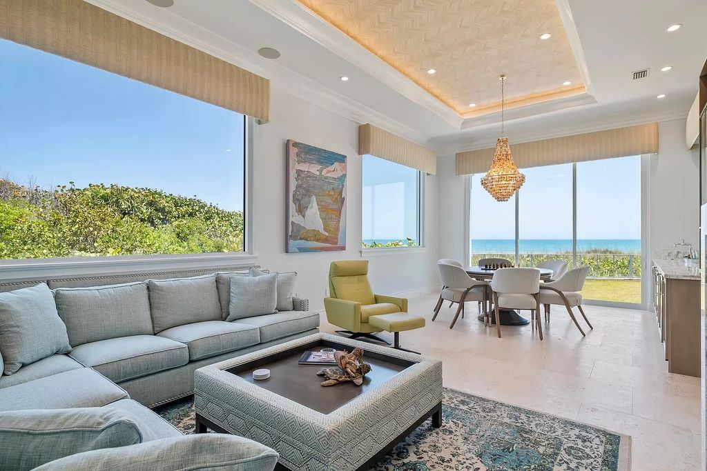 Immerse yourself in unparalleled luxury at this 5-bedroom, 5.3-bathroom West Indies-inspired estate. Featuring a gourmet chef's kitchen, resort-style pool and spa, elevator, and sweeping oceanfront vistas, this masterpiece offers seamless indoor-outdoor living.