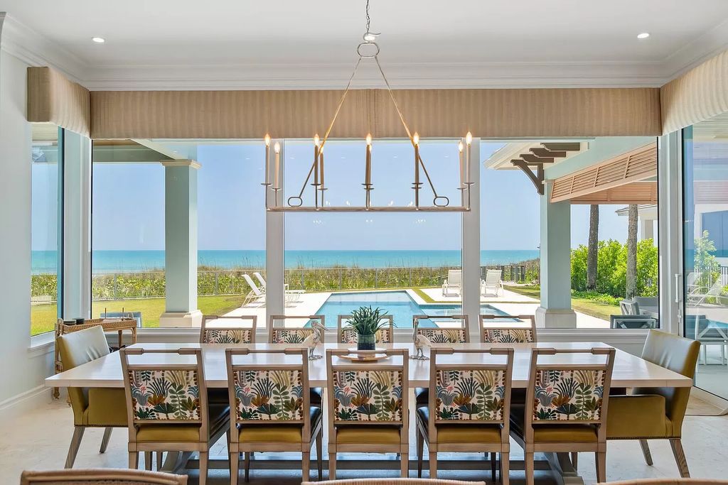 Immerse yourself in unparalleled luxury at this 5-bedroom, 5.3-bathroom West Indies-inspired estate. Featuring a gourmet chef's kitchen, resort-style pool and spa, elevator, and sweeping oceanfront vistas, this masterpiece offers seamless indoor-outdoor living.