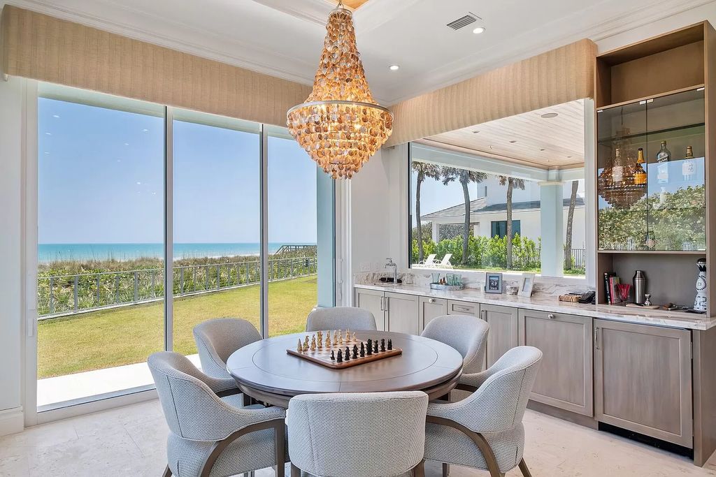 Immerse yourself in unparalleled luxury at this 5-bedroom, 5.3-bathroom West Indies-inspired estate. Featuring a gourmet chef's kitchen, resort-style pool and spa, elevator, and sweeping oceanfront vistas, this masterpiece offers seamless indoor-outdoor living.