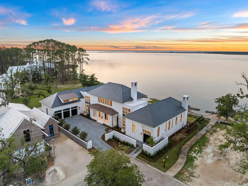 This extraordinary 7,587 square feet residence boasts 6 spacious bedrooms, 7 custom bathrooms, an infinity pool with swim-up bar, a coveted 70' private boat slip, and breathtaking bay views.