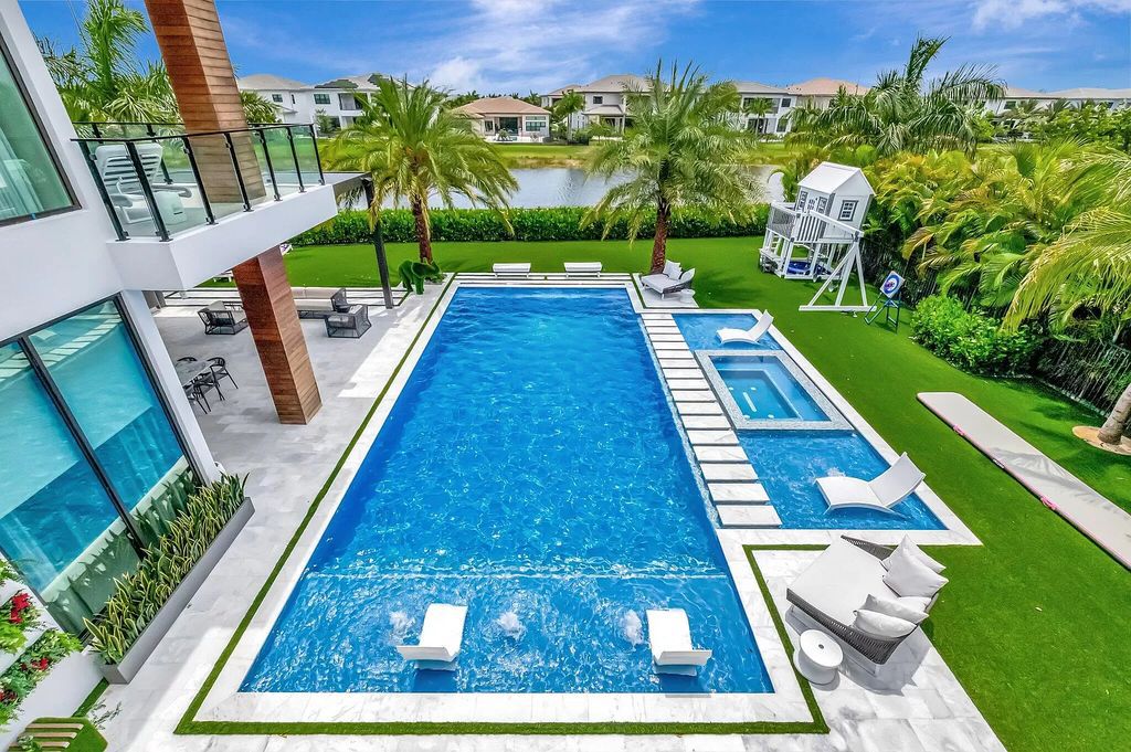 This 8,000 square feet masterpiece boasts 6 bedrooms, 7.5 baths, a waterfront location, a resort-style pool and spa, custom upgrades throughout, and breathtaking water views.