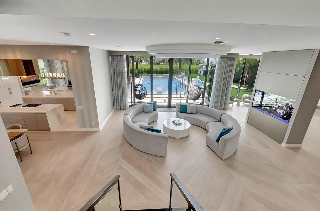 This 8,000 square feet masterpiece boasts 6 bedrooms, 7.5 baths, a waterfront location, a resort-style pool and spa, custom upgrades throughout, and breathtaking water views.