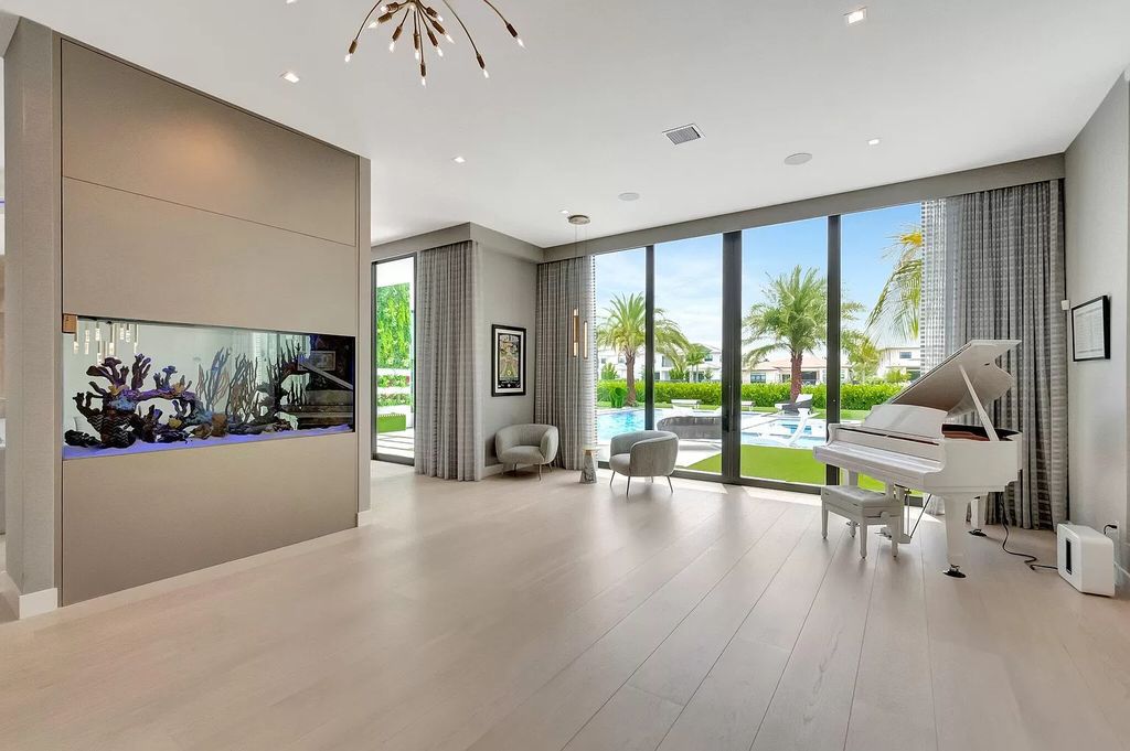 This 8,000 square feet masterpiece boasts 6 bedrooms, 7.5 baths, a waterfront location, a resort-style pool and spa, custom upgrades throughout, and breathtaking water views.