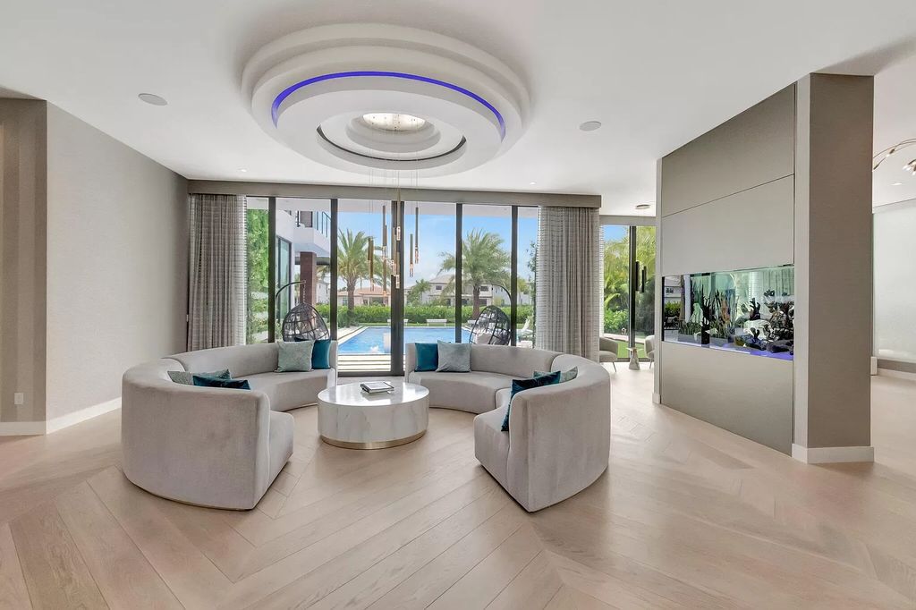 This 8,000 square feet masterpiece boasts 6 bedrooms, 7.5 baths, a waterfront location, a resort-style pool and spa, custom upgrades throughout, and breathtaking water views.