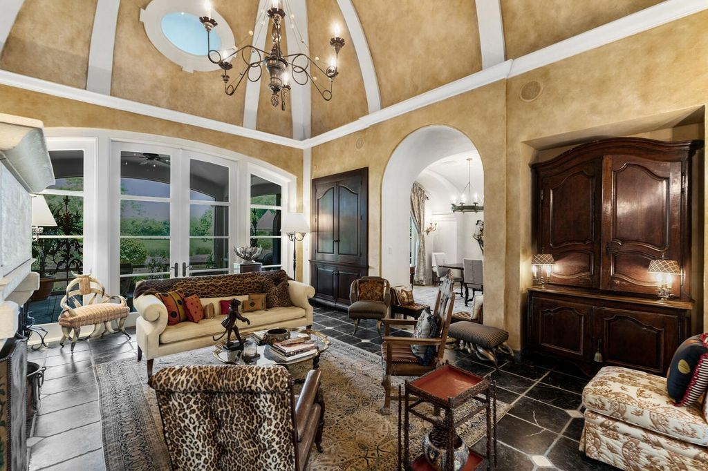 Live in Unrivaled Luxury! This 5-bedroom Bridle Path estate boasts an AIA-recognized octagonal turret, grand hall, chef's kitchen, screened loggia, pool, and lush landscaping. Move-in ready with new roof, generator, impact windows and more!