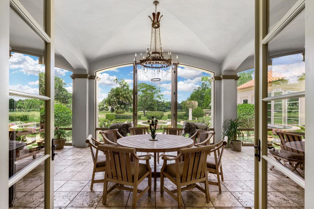 Live in Unrivaled Luxury! This 5-bedroom Bridle Path estate boasts an AIA-recognized octagonal turret, grand hall, chef's kitchen, screened loggia, pool, and lush landscaping. Move-in ready with new roof, generator, impact windows and more!