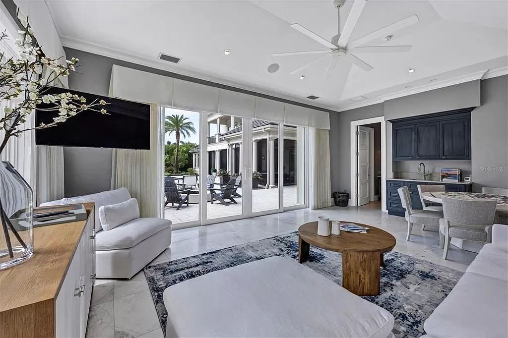 Experience the epitome of luxurious living in this 5-bed estate designed by renowned builders and designers. Featuring a gourmet kitchen, spa-like master suite, saltwater pool and casita, this home redefines Florida living.