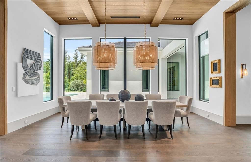 Built by Borelli Construction and designed by Carrie Brigham Design, this modern Tudor masterpiece boasts a chef's kitchen, expansive game room with wet bar, sparkling pool with pool house, private guest casita, resort-style lanai with fireplace, and top-of-the-line finishes throughout.