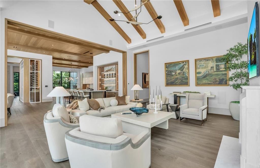 Built by Borelli Construction and designed by Carrie Brigham Design, this modern Tudor masterpiece boasts a chef's kitchen, expansive game room with wet bar, sparkling pool with pool house, private guest casita, resort-style lanai with fireplace, and top-of-the-line finishes throughout.