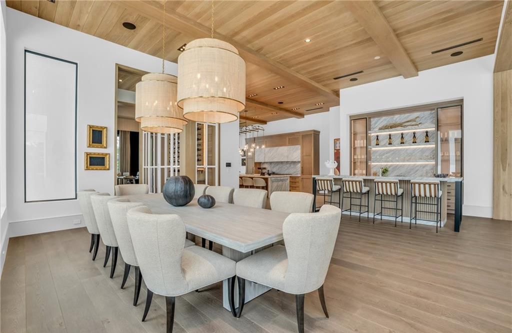 Built by Borelli Construction and designed by Carrie Brigham Design, this modern Tudor masterpiece boasts a chef's kitchen, expansive game room with wet bar, sparkling pool with pool house, private guest casita, resort-style lanai with fireplace, and top-of-the-line finishes throughout.