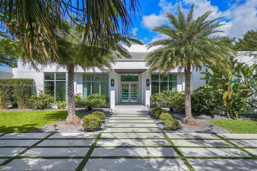 Featuring an infinity pool, a modern kitchen with top-of-the-line appliances, a stunning master suite, and close proximity to Gulliver Preparatory School, this expansive property offers the perfect blend of indoor and outdoor living.