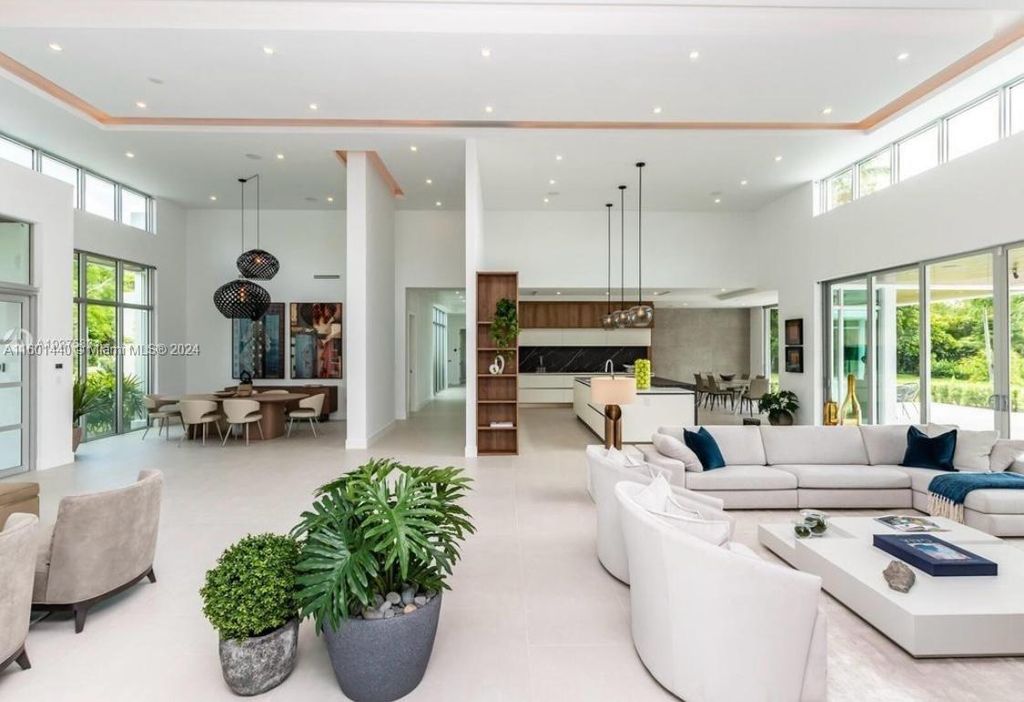 Featuring an infinity pool, a modern kitchen with top-of-the-line appliances, a stunning master suite, and close proximity to Gulliver Preparatory School, this expansive property offers the perfect blend of indoor and outdoor living.