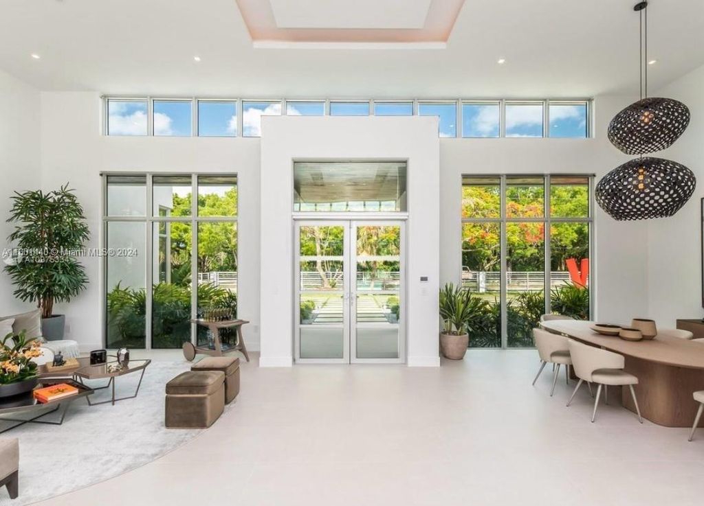 Featuring an infinity pool, a modern kitchen with top-of-the-line appliances, a stunning master suite, and close proximity to Gulliver Preparatory School, this expansive property offers the perfect blend of indoor and outdoor living.